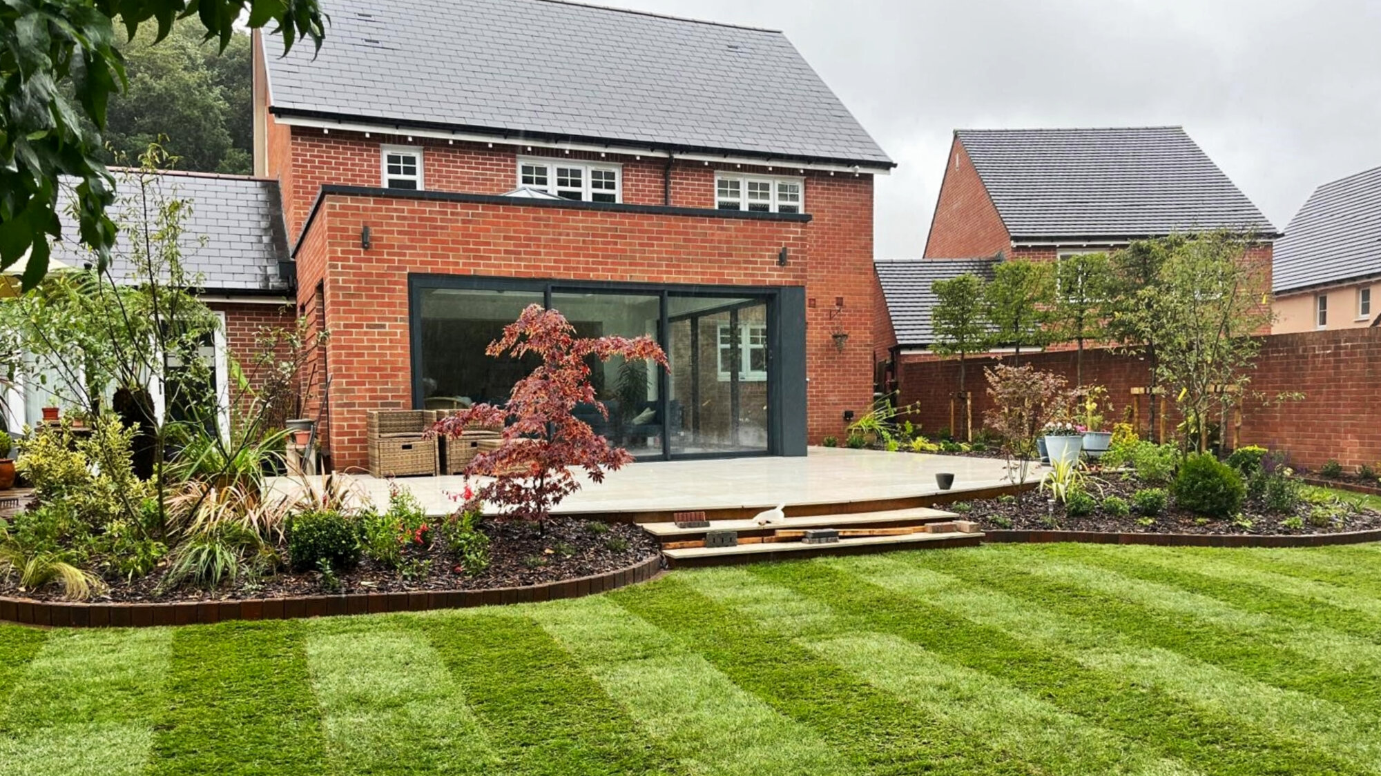 Resin driveway and landscaped entrance